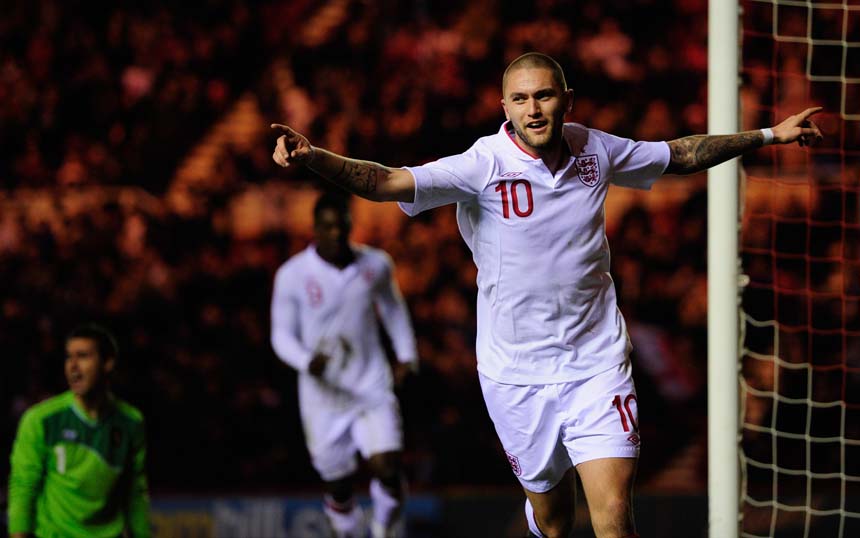 Henri Lansbury celebrates his first goal against Belgium.